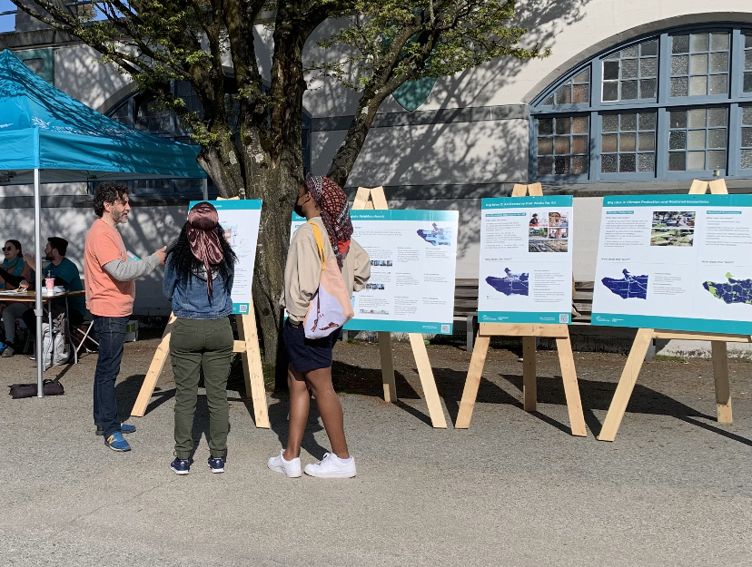Vancouver Plan public engagement team speaking to community members on English Bay Beach